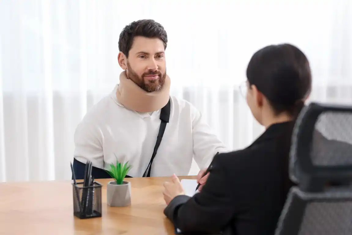 An injured man talking to a lawyer