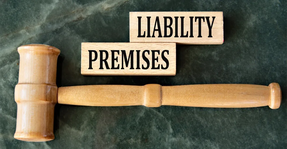 A wooden gavel positioned between two wooden blocks